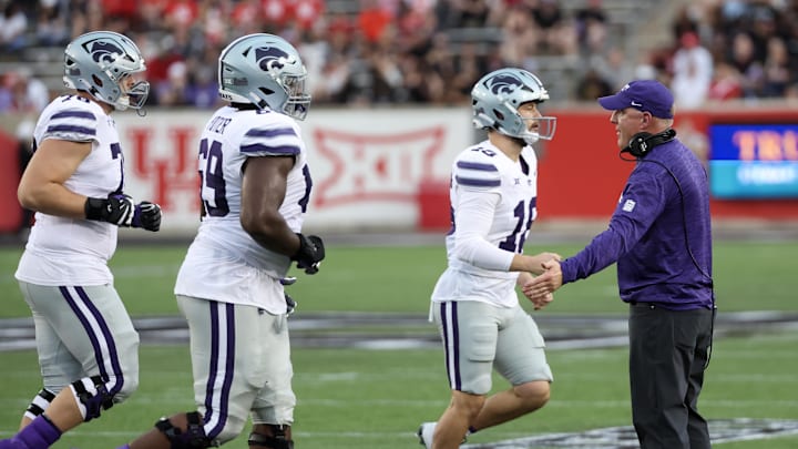Nov 2, 2024; Houston, Texas, USA; Kansas State Wildcats head coach Chris Klieman low fives quarterback Hudson Hutcheson (18) after a field goal against the Houston Cougars in the first quarter at TDECU Stadium. Mandatory Credit: Thomas B. Shea-Imagn Images