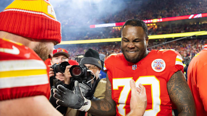 Jan 26, 2025; Kansas City, MO, USA; Kansas City Chiefs offensive tackle D.J. Humphries (70) and tight end Travis Kelce (87) celebrate after defeating the Buffalo Bills during the AFC Championship game at GEHA Field at Arrowhead Stadium. Mandatory Credit: Mark J. Rebilas-Imagn Images