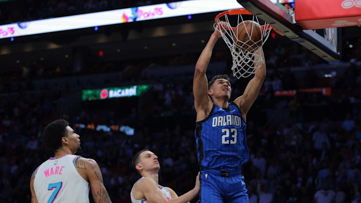 Orlando Magic forward Tristan da Silva (23) dunks past Miami Heat forward Nikola Jovic (5) and center Kel'el Ware (7) during the third quarter at Kaseya Center.