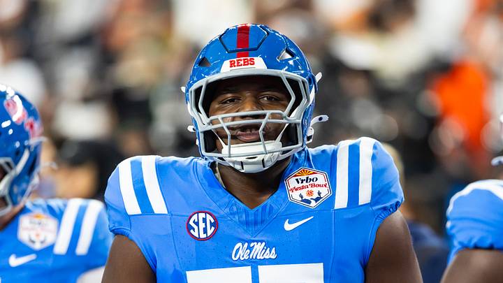 Jan 8, 2026; Glendale, AZ, USA; Mississippi Rebels offensive lineman Ethan Fields (77) against the Miami Hurricanes during the 2026 Fiesta Bowl and semifinal game of the College Football Playoff at State Farm Stadium. Mandatory Credit: Mark J. Rebilas-Imagn Images