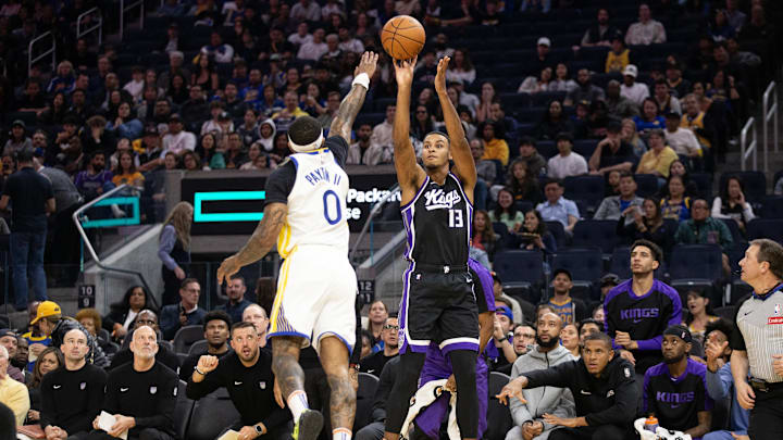 Oct 11, 2024; San Francisco, California, USA; Sacramento Kings forward Keegan Murray (13) shoots over Golden State Warriors guard Gary Payton II (0) during the first quarter at Chase Center. Mandatory Credit: D. Ross Cameron-Imagn Images