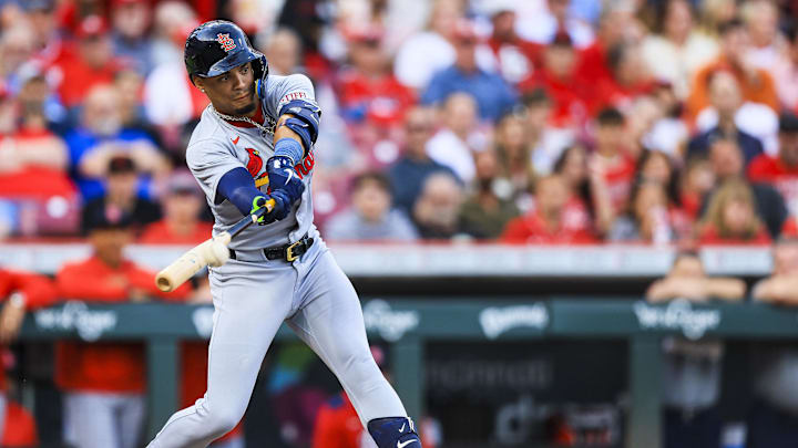 Aug 29, 2025; Cincinnati, Ohio, USA; St. Louis Cardinals shortstop Masyn Winn (0) hits a RBI single in the third inning against the Cincinnati Reds at Great American Ball Park. Mandatory Credit: Katie Stratman-Imagn Images