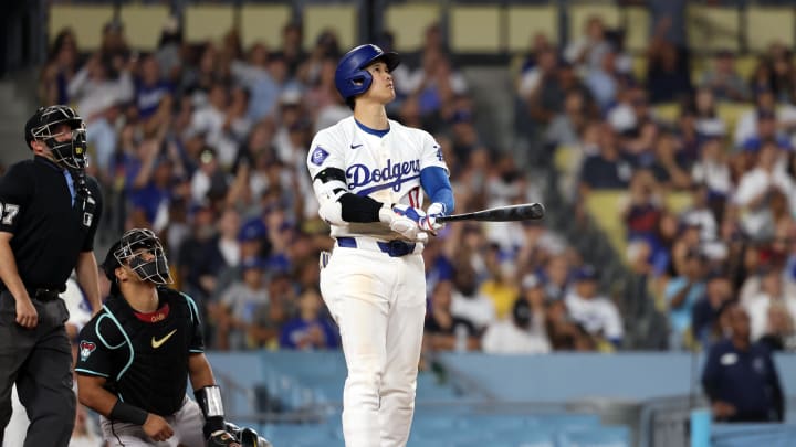 Jul 2, 2024; Los Angeles, California, USA;  Los Angeles Dodgers designated hitter Shohei Ohtani (17) hits a two-run home run during the seventh inning against the Arizona Diamondbacks at Dodger Stadium. Mandatory Credit: Kiyoshi Mio-USA TODAY Sports