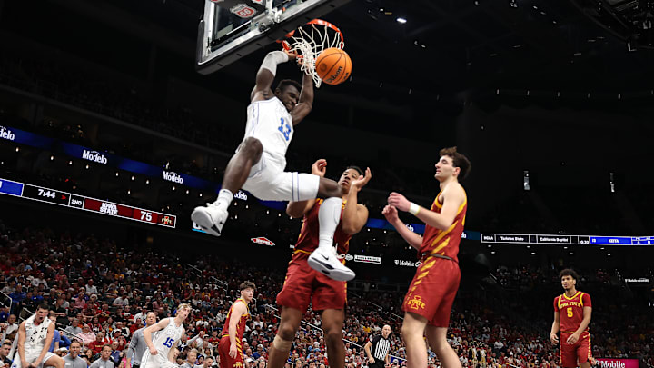 BYU's Keba Keita dunks the ball against Iowa State