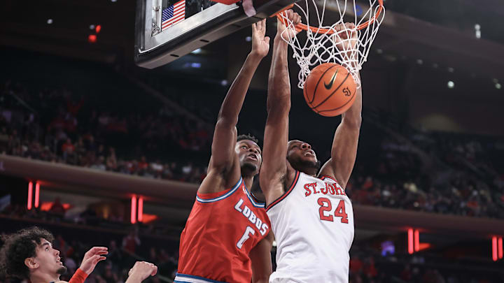 Nov 17, 2024; New York, New York, USA;  St. John's basketball forward Zuby Ejiofor (24) dunks against New Mexico Lobos forward Atiki Ally Atiki (6) in the second half at Madison Square Garden. Mandatory Credit: Wendell Cruz-Imagn Images
