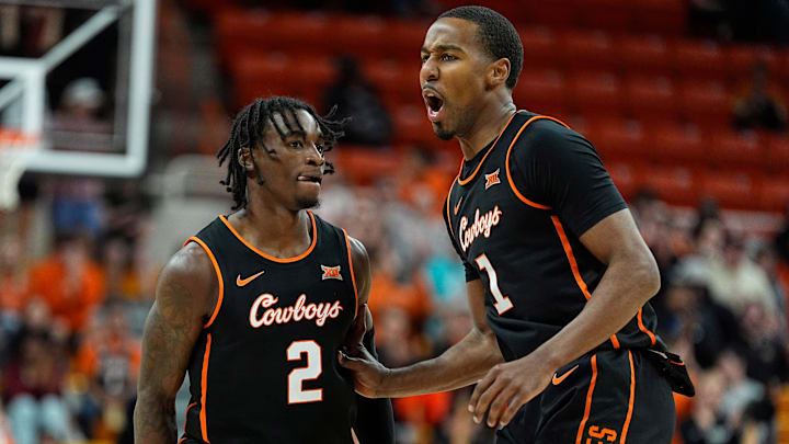 Oklahoma State's Arturo Dean (2) and Bryce Thompson celebrate during the college basketball game between the Oklahoma State University Cowboys and the Southern Illinois Salukis, Thursday, Nov. 14, 2024.