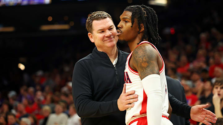 Dec 20, 2023; Phoenix, Arizona, USA; Arizona Wildcats head coach Tommy Lloyd talks to guard Caleb Love (2) during the second half of the game against the Alabama Crimson Tide in the Hall of Fame Series at Footprint Center. Mandatory Credit: Mark J. Rebilas-Imagn Images