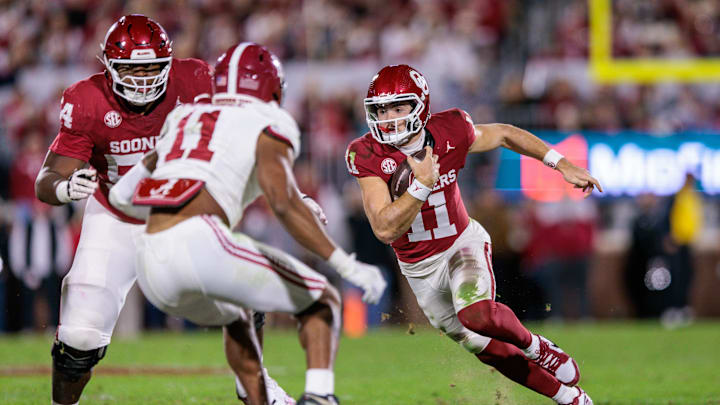 Nov 23, 2024; Norman, Oklahoma, USA; Oklahoma Sooners quarterback Jackson Arnold (11) runs the ball during the second quarter against the Alabama Crimson Tide at Gaylord Family-Oklahoma Memorial Stadium. Mandatory Credit: William Purnell-Imagn Images