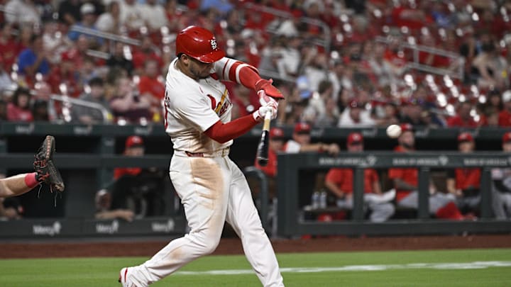Sep 15, 2025; St. Louis, Missouri, USA; St. Louis Cardinals first baseman Willson Contreras (40) hits a RBI single against the Cincinnati Reds in the sixth inning at Busch Stadium. Mandatory Credit: Joe Puetz-Imagn Images