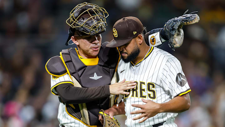 Sep 23, 2025; San Diego, California, USA; San Diego Padres catcher Freddy Fermin (54) walks starting pitcher Randy Vasquez (98) in after being hit by a ball during the fourth inning against the Milwaukee Brewers at Petco Park. Mandatory Credit: David Frerker-Imagn Images