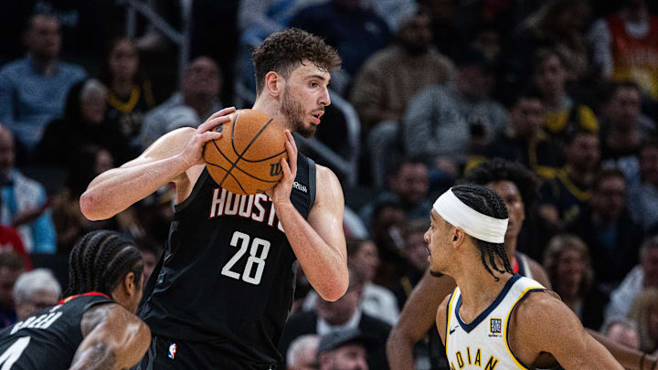Mar 4, 2025; Indianapolis, Indiana, USA; Houston Rockets center Alperen Sengun (28) holds the ball while Indiana Pacers guard Andrew Nembhard (2) defends in the second half at Gainbridge Fieldhouse. Mandatory Credit: Trevor Ruszkowski-Imagn Images