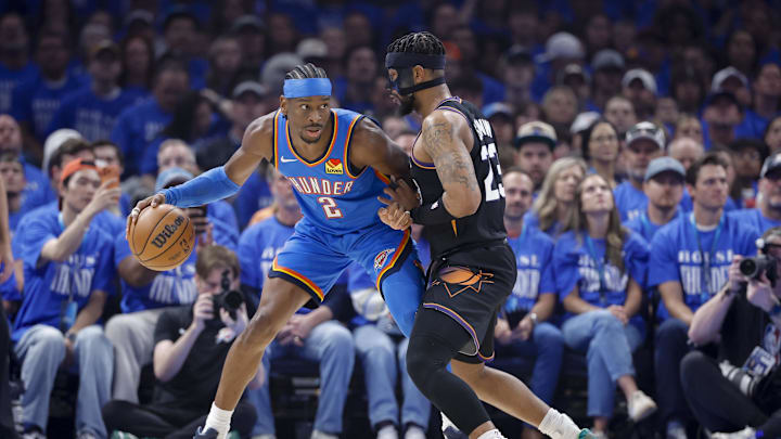 Apr 19, 2026; Oklahoma City, Oklahoma, USA; Oklahoma City Thunder guard Shai Gilgeous-Alexander (2) drives as Phoenix Suns guard Jordan Goodwin (23) defends in the first quarter during game one of the first round of the 2026 NBA Playoffs at Paycom Center. Mandatory Credit: Alonzo Adams-Imagn Images
