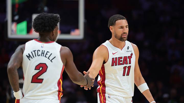 Oct 8, 2026; Miami, Florida, USA; Miami Heat guard Klay Thompson (11) high-fives with guard Davion Mitchell (2) against the New Orleans Pelicans during the first quarter at Kaseya Center. Mandatory Credit: Sam Navarro-Imagn Images