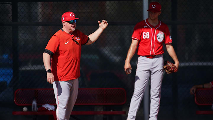 Cincinnati Reds pitching coach Derek Johnson instructs Cincinnati Reds starting pitcher Carson Spiers (68) in the bullpen during spring training workouts, Thursday, Feb. 15, 2024, at the team   s spring training facility in Goodyear, Ariz.