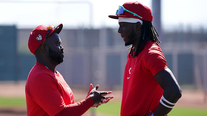 Dayton Dragons manager Vince Harrison talks with Cincinnati Reds third baseman Elly De La Cruz (44) during spring training workouts, Wednesday, Feb. 14, 2024, at the team s spring training facility in Goodyear, Ariz. Dayton Dragons manager Vince Harrison talks with Cincinnati Reds third baseman Elly De La Cruz (44) during spring training workouts, Wednesday, Feb. 14, 2024, at the team s spring training facility in Goodyear, Ariz.
