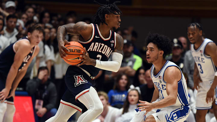 Nov 10, 2023; Durham, North Carolina, USA;  Arizona Wildcats guard Caleb Love (2) drives to the basket as Duke Blue Devils guard Jared McCain (0) defends during the second half at Cameron Indoor Stadium. Mandatory Credit: Rob Kinnan-Imagn Images
