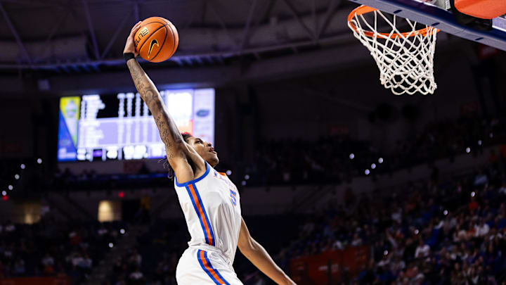 Feb 13, 2024; Gainesville, Florida, USA; Florida Gators guard Will Richard (5) dunks the ball