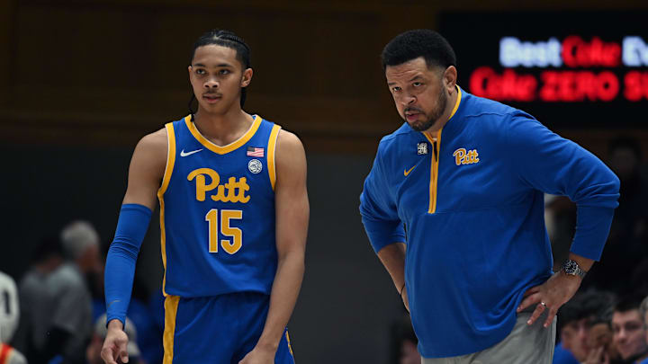 Jan 7, 2025; Durham, North Carolina, USA; Pitt Panthers head coach Jeff Capel (right) talks to guard Jaland Lowe (15) during the first half against the Duke Blue Devils at Cameron Indoor Stadium. Mandatory Credit: Rob Kinnan-Imagn Images Jan 7, 2025; Durham, North Carolina, USA; Pitt Panthers head coach Jeff Capel (right) talks to guard Jaland Lowe (15) during the first half against the Duke Blue Devils at Cameron Indoor Stadium. Mandatory Credit: Rob Kinnan-Imagn Images