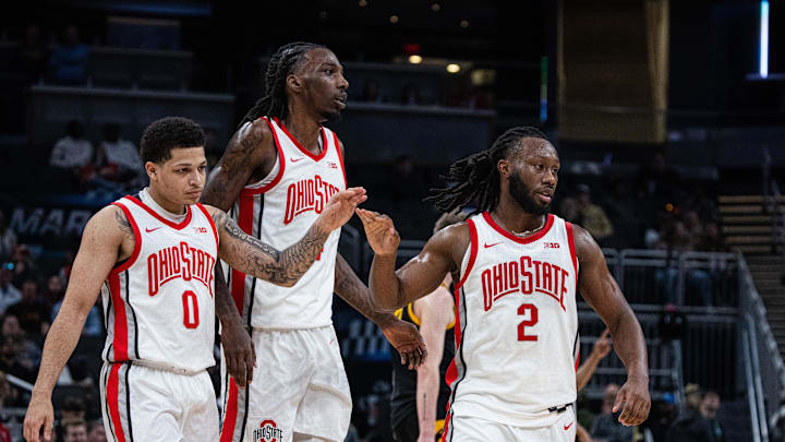 Mar 12, 2025; Indianapolis, IN, USA; Ohio State Buckeyes guard John Mobley Jr. (0) celebrates with  forward Aaron Bradshaw (4) and guard Bruce Thornton (2) after a basket in the first half against the Iowa Hawkeyes at Gainbridge Fieldhouse. Mandatory Credit: Trevor Ruszkowski-Imagn Images