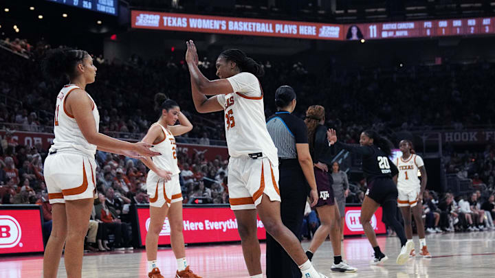 Jan 18, 2026; Austin, Texas, USA; Texas Longhorns forward Madison Booker (35) and forward Justice Carlton (11) celebrate a foul by the Texas A&M Aggies during the second quarter at Moody Center. Mandatory Credit: Dustin Safranek-Imagn Images Jan 18, 2026; Austin, Texas, USA; Texas Longhorns forward Madison Booker (35) and forward Justice Carlton (11) celebrate a foul by the Texas A&M Aggies during the second quarter at Moody Center. Mandatory Credit: Dustin Safranek-Imagn Images