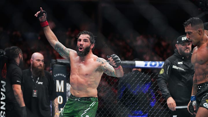Dec 2, 2023; Austin, Texas, USA; Clay Guida (red gloves) fights Joaquim Silva (blue gloves) during UFC Fight Night at Moody Center. Mandatory Credit: Dustin Safranek-Imagn Images