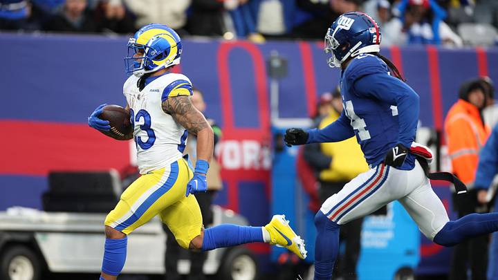 Dec 31, 2023; East Rutherford, New Jersey, USA; Los Angeles Rams running back Kyren Williams (23) scores a rushing touchdown during the second half in front of New York Giants safety Dane Belton (24) at MetLife Stadium. Mandatory Credit: Vincent Carchietta-USA TODAY Sports Dec 31, 2023; East Rutherford, New Jersey, USA; Los Angeles Rams running back Kyren Williams (23) scores a rushing touchdown during the second half in front of New York Giants safety Dane Belton (24) at MetLife Stadium. Mandatory Credit: Vincent Carchietta-USA TODAY Sports