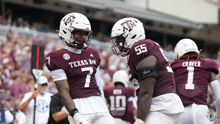 Sep 6, 2025; College Station, Texas, USA; Texas A&M Aggies wide receiver KC Concepcion (7) and Texas A&M Aggies offensive lineman Ar'maj Reed-Adams (55) celebrate after a touchdown during the second quarter against the Utah State Aggies at Kyle Field. Mandatory Credit: Sean Thomas-Imagn Images