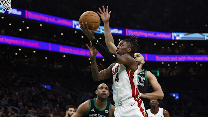 May 1, 2024; Boston, Massachusetts, USA; Miami Heat guard Delon Wright (4) goes to the basket past Boston Celtics guard Derrick White (9) during the first quarter of game five of the first round of the 2024 NBA playoffs at TD Garden. Mandatory Credit: Winslow Townson-Imagn Images