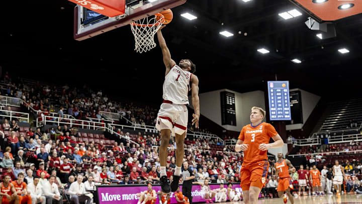 Feb 4, 2026; Stanford, California, USA;  Stanford Cardinal guard Ebuka Okorie (1) dunks against Clemson Tigers forward Chase Thompson (3) during the first half at Maples Pavilion. Mandatory Credit: John Hefti-Imagn Images