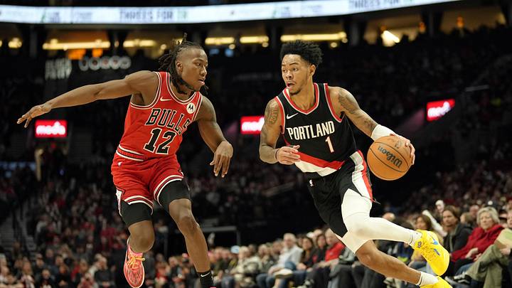 Jan 28, 2024; Portland, Oregon, USA; Portland Trail Blazers shooting guard Anfernee Simons (1) dribbles the ball while defended by Chicago Bulls shooting guard Ayo Dosunmu (12) during the second half at Moda Center. Mandatory Credit: Soobum Im-Imagn Images Jan 28, 2024; Portland, Oregon, USA; Portland Trail Blazers shooting guard Anfernee Simons (1) dribbles the ball while defended by Chicago Bulls shooting guard Ayo Dosunmu (12) during the second half at Moda Center. Mandatory Credit: Soobum Im-Imagn Images