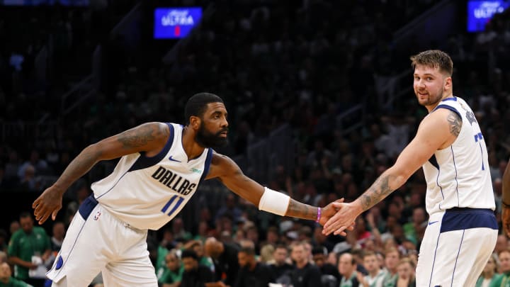 Jun 9, 2024; Boston, Massachusetts, USA; Dallas Mavericks guard Kyrie Irving (11) high fives guard Luka Doncic (77) after a play against the Boston Celtics during the first quarter in game two of the 2024 NBA Finals at TD Garden. Mandatory Credit: Peter Casey-USA TODAY Sports