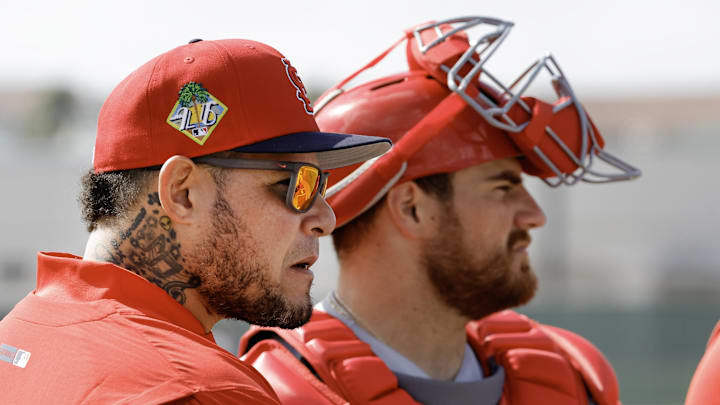 Feb 16, 2026; Jupiter, FL, USA;  St. Louis Cardinals great Yadier Molina (left) talks with catcher Pedro Pages (43)  during spring training workouts at Roger Dean Stadium. Mandatory Credit: Reinhold Matay-Imagn Images