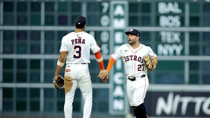 Houston Astros shortstop Jeremy Pena (3) congratulates Houston Astros left fielder Jose Altuve (27) after the final out against the Seattle Mariners during the ninth inning at Daikin Park on May 22.