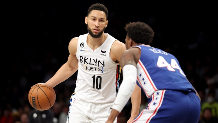 Feb 11, 2023; Brooklyn, New York, USA; Brooklyn Nets guard Ben Simmons (10) controls the ball against Philadelphia 76ers forward Paul Reed (44) during the fourth quarter at Barclays Center. Mandatory Credit: Brad Penner-Imagn Images