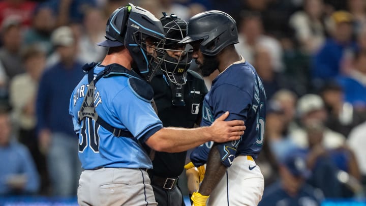 Tampa Bay Rays catcher Ben Rortvedt (30) checks on Seattle Mariners left fielder Randy Arozarena (56) after Arozarena was hit by a pitch during the fifth inning at T-Mobile Park on Aug 26. Tampa Bay Rays catcher Ben Rortvedt (30) checks on Seattle Mariners left fielder Randy Arozarena (56) after Arozarena was hit by a pitch during the fifth inning at T-Mobile Park on Aug 26.