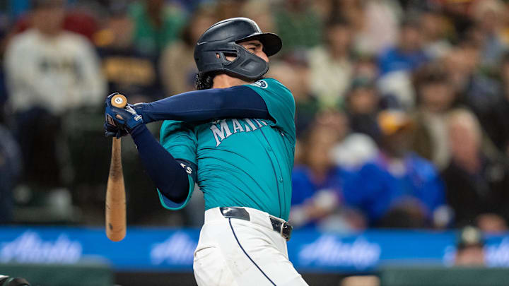 Seattle Mariners third baseman Josh Rojas (4) hits a two-run single during the fourth inning against the Oakland Athletics at T-Mobile Park on Sept 28. Seattle Mariners third baseman Josh Rojas (4) hits a two-run single during the fourth inning against the Oakland Athletics at T-Mobile Park on Sept 28.