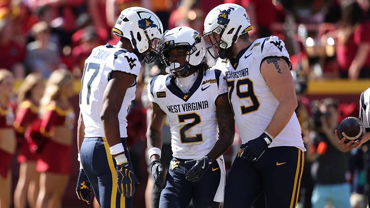 Oct 3, 2026; Ames, Iowa, USA; West Virginia Mountaineers wide receiver DJ Epps (2) celebrates with teammates West Virginia Mountaineers wide receiver Prince Strachan (17) and West Virginia Mountaineers offensive lineman Carsten Casady (79) after the touchdown against the Iowa State Cyclones during the second half at Jack Trice Stadium. Mandatory Credit: Reese Strickland-Imagn Images Oct 3, 2026; Ames, Iowa, USA; West Virginia Mountaineers wide receiver DJ Epps (2) celebrates with teammates West Virginia Mountaineers wide receiver Prince Strachan (17) and West Virginia Mountaineers offensive lineman Carsten Casady (79) after the touchdown against the Iowa State Cyclones during the second half at Jack Trice Stadium. Mandatory Credit: Reese Strickland-Imagn Images