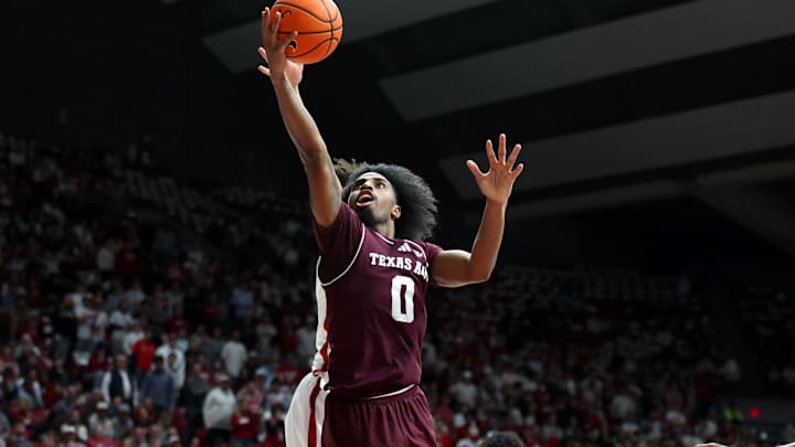 Feb 4, 2026; Tuscaloosa, Alabama, USA; Texas A&M Aggies guard Marcus Hill (0) shoots during the first half against the Alabama Crimson Tide at Coleman Coliseum. Mandatory Credit: David Leong-Imagn Images
