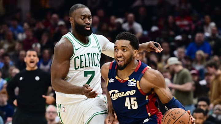 Mar 8, 2026; Cleveland, Ohio, USA; Cleveland Cavaliers guard Donovan Mitchell (45) drives to the basket against Boston Celtics guard Jaylen Brown (7) during the second half at Rocket Arena. Mandatory Credit: Ken Blaze-Imagn Images