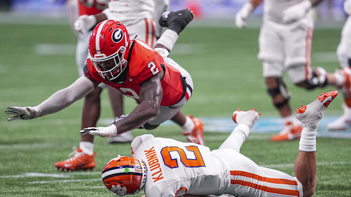 Aug 31, 2024; Atlanta, Georgia, USA; Georgia Bulldogs linebacker Smael Mondon Jr. (2) flies over Clemson Tigers quarterback Cade Klubnik (2) during the second half at Mercedes-Benz Stadium. Mandatory Credit: Dale Zanine-Imagn Images Aug 31, 2024; Atlanta, Georgia, USA; Georgia Bulldogs linebacker Smael Mondon Jr. (2) flies over Clemson Tigers quarterback Cade Klubnik (2) during the second half at Mercedes-Benz Stadium. Mandatory Credit: Dale Zanine-Imagn Images