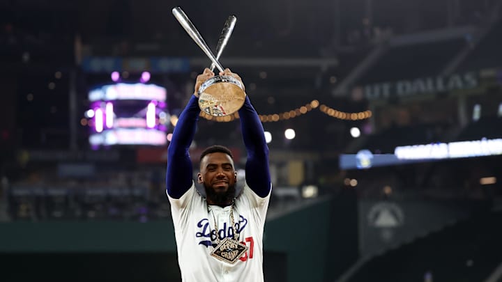 Jul 15, 2024; Arlington, TX, USA; National League outfielder Teoscar Hernandez of the Los Angeles Dodgers (37) poses with the trophy after winning the 2024 Home Run Derby at Globe Life Field: Kevin Jairaj-USA TODAY Sports