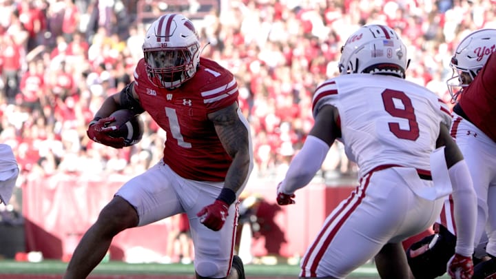Wisconsin running back Chez Mellusi (1) finds a seam in the South Dakota defense during the fourth quarter of their game Saturday, September 7 , 2024 at Camp Randall Stadium in Madison, Wisconsin.