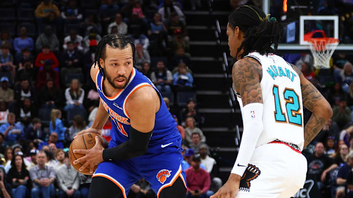 Feb 28, 2025; Memphis, Tennessee, USA; New York Knicks guard Jalen Brunson (11) handles the ball as Memphis Grizzlies guard Ja Morant (12) defends during the second quarter at FedExForum. Mandatory Credit: Petre Thomas-Imagn Images