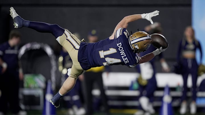 Montana State wide receiver Taco Dowler (14) leaps into the end zone for a touchdown against Illinois State during the FCS National Championship
