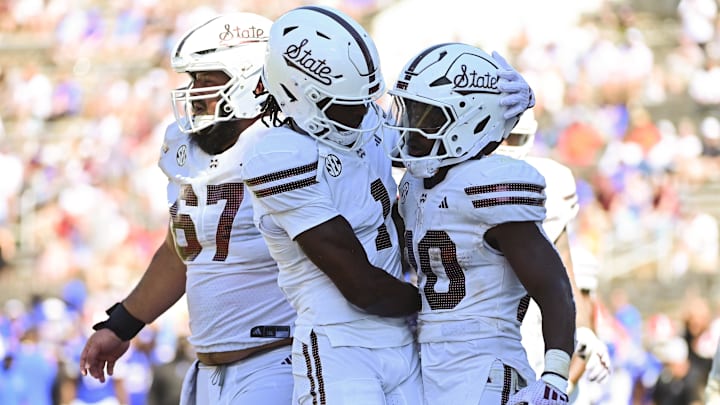 Sep 21, 2024; Starkville, Mississippi, USA; Mississippi State Bulldogs running back Johnnie Daniels (20) reacts with teammates after a touchdown against the Florida Gators during the fourth quarter at Davis Wade Stadium at Scott Field. Mandatory Credit: Matt Bush-Imagn Images