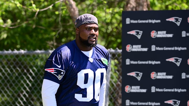Jun 10, 2024; Foxborough, MA, USA; New England Patriots defensive tackle Christian Barmore (90) walks to the practice fields for minicamp at Gillette Stadium. Mandatory Credit: Eric Canha-Imagn Images