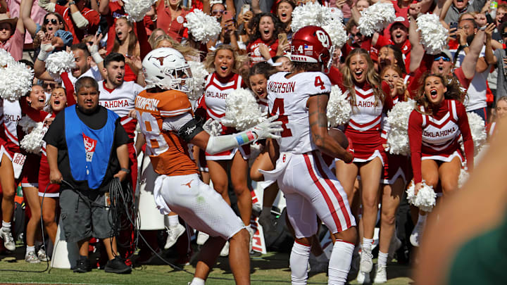 Oklahoma Sooners wide receiver Nic Anderson (4) celebrates a touchdown beside Texas Longhorns
