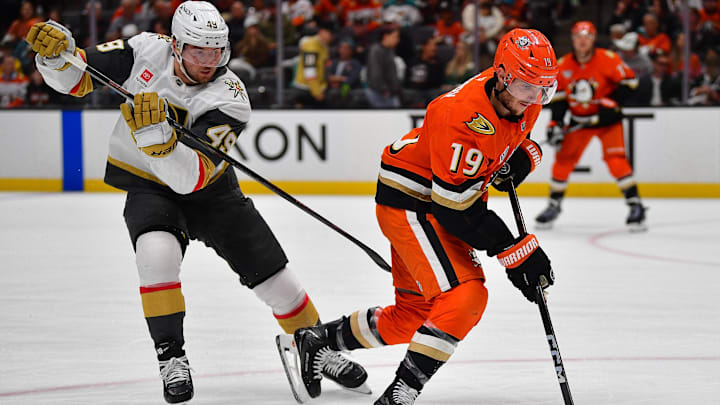 May 8, 2026; Anaheim, California, USA; Anaheim Ducks right wing Troy Terry (19) moves the puck ahead of Vegas Golden Knights left wing Ivan Barbashev (49) during the third period in game three of the second round of the 2026 Stanley Cup Playoffs at Honda Center. Mandatory Credit: Gary A. Vasquez-Imagn Images