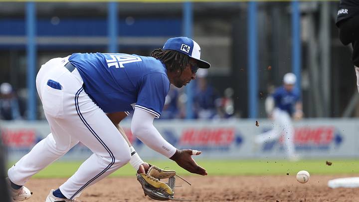 Feb 22, 2025; Dunedin, Florida, USA;  Toronto Blue Jays infielder Charles McAdoo (84) fields the ball before throwing to first base for an out during the fifth inning against the New York Yankees at TD Ballpark. Mandatory Credit: Kim Klement Neitzel-Imagn Images