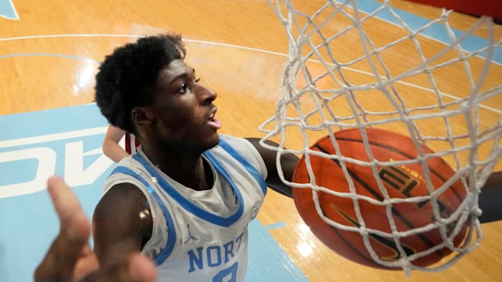 Dec 4, 2024; Chapel Hill, North Carolina, USA; North Carolina Tar Heels guard Drake Powell (9) scores in the second half at Dean E. Smith Center. Mandatory Credit: Bob Donnan-Imagn Images